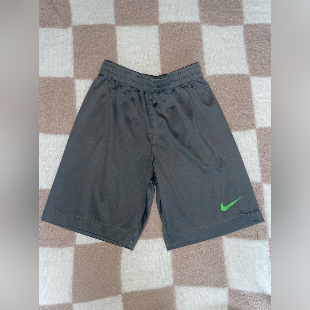 Nike Boy's Black Athletic Shorts with Green Swoosh Accent